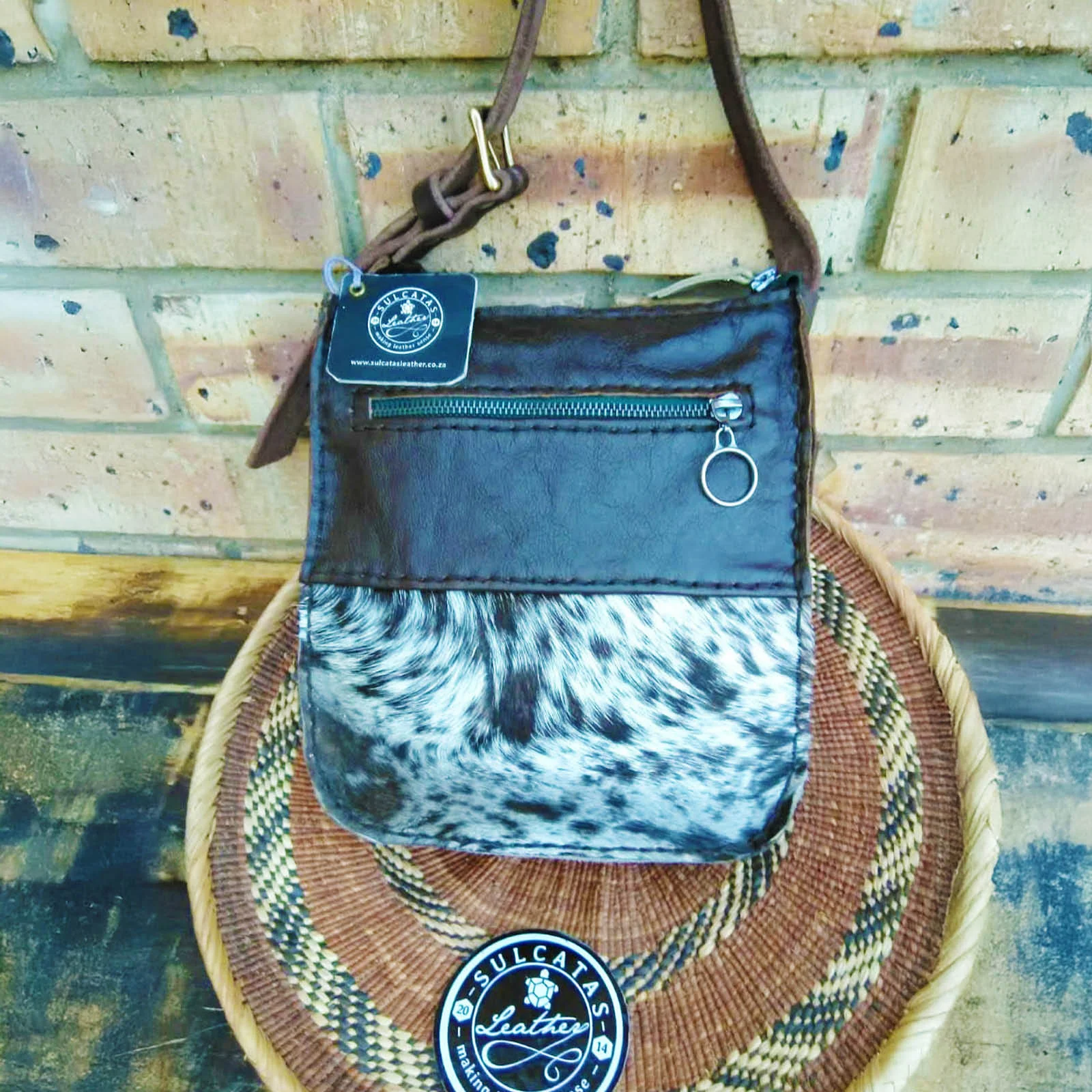 black and speckled nguni hide leather sling bag black and speckled nguni hide leather sling bag