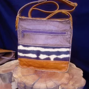 brown and tan zebra hide leather sling bag