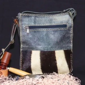 charcoal and speckled hide sling bag